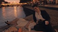 As part of her grief journey in My Oxford Year, Anna imagines Jamie beside her in Paris—until reality sets in, and she realizes she’s traveling alone (Image via Netflix)